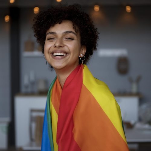 beautiful-curly-woman-with-lgbt-flag